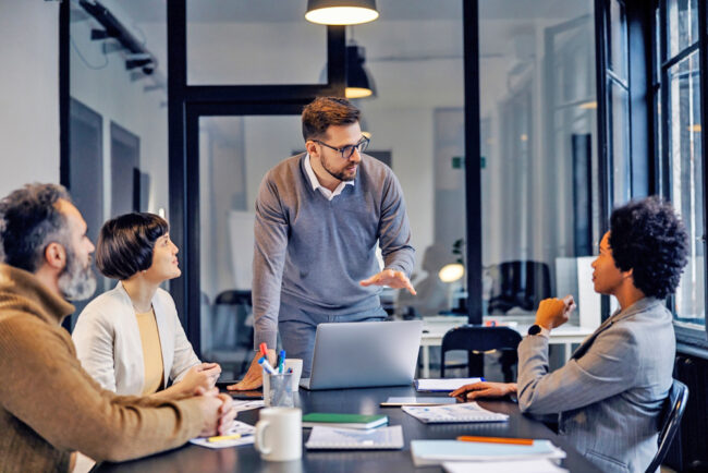 A,Focused,Businessman,Is,Having,Presentation,About,Project,At,The